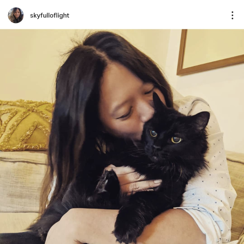 A photo of Gwen, the human counterpart of the 3AMΣ project, with her cat.