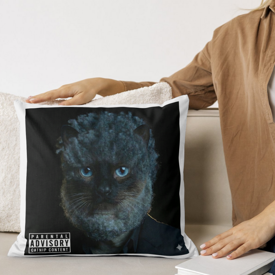 A white pillow on a bed with a pillowcase featuring the 3AMΣ album art.